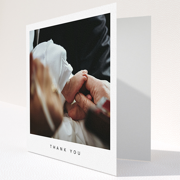 A baptism thank you card named "Simple Thanks". It is a square (148mm x 148mm) card in a square orientation. It is a photographic baptism thank you card with room for 1 photo. "Simple Thanks" is available as a folded card, with mainly white colouring.