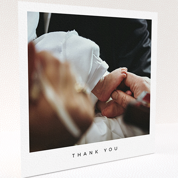 A baptism thank you card named "Simple Thanks". It is a square (148mm x 148mm) card in a square orientation. It is a photographic baptism thank you card with room for 1 photo. "Simple Thanks" is available as a folded card, with mainly white colouring.