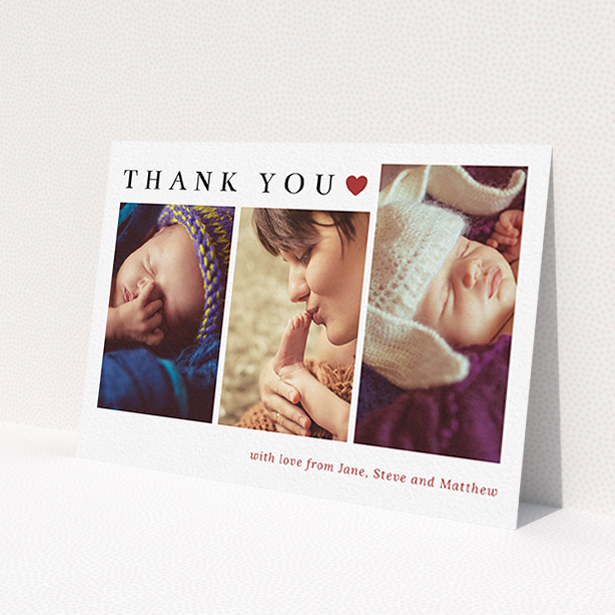 A baptism thank you card design named 'Simply Thanks'. It is an A6 card in a landscape orientation. It is a photographic baptism thank you card with room for 3 photos. 'Simply Thanks' is available as a flat card, with tones of white and red.