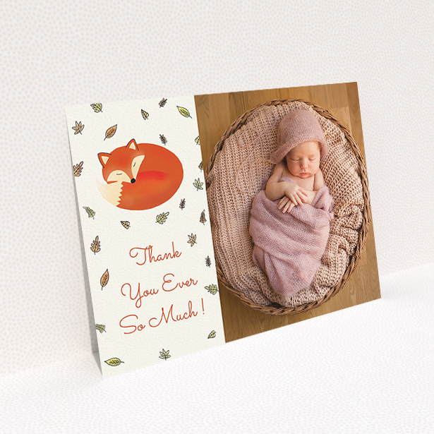 A baptism thank you card named "Sleepy Fox". It is an A5 card in a landscape orientation. It is a photographic baptism thank you card with room for 1 photo. "Sleepy Fox" is available as a flat card, with tones of cream, orange and light yellow.