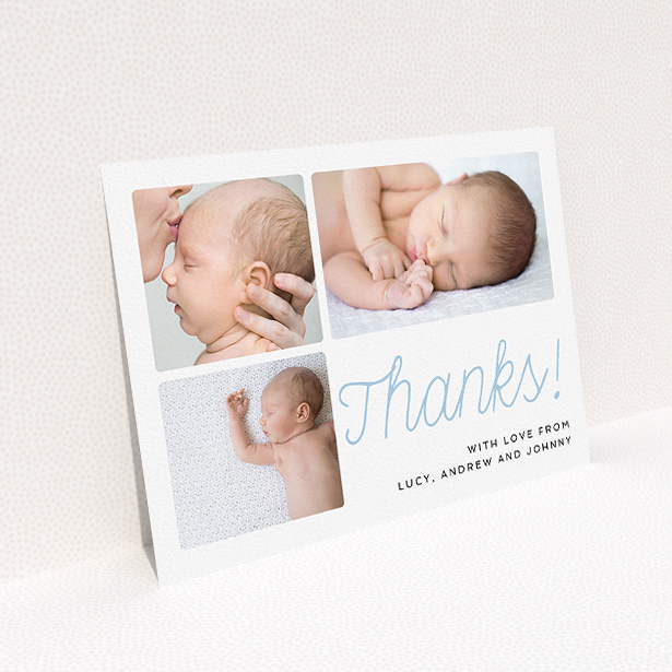 A baptism thank you card design called "Thank You Cursive". It is an A5 card in a landscape orientation. It is a photographic baptism thank you card with room for 3 photos. "Thank You Cursive" is available as a flat card, with tones of white and blue.