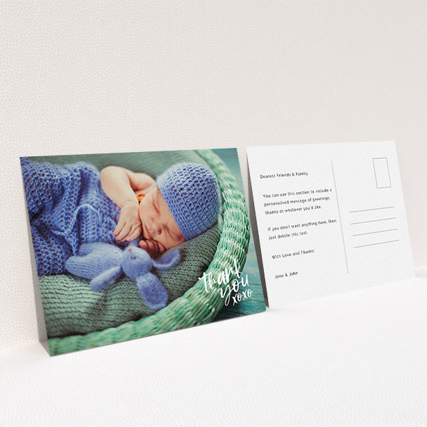 A baptism thank you card design called "Thanks In the Corner". It is an A6 card in a landscape orientation. It is a photographic baptism thank you card with room for 1 photo. "Thanks In the Corner" is available as a flat card, with mainly white colouring.