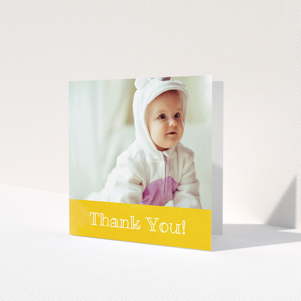 A baptism thank you card design called 'Thanks In Yellow'. It is a square (148mm x 148mm) card in a square orientation. It is a photographic baptism thank you card with room for 1 photo. 'Thanks In Yellow' is available as a folded card, with tones of yellow and white.