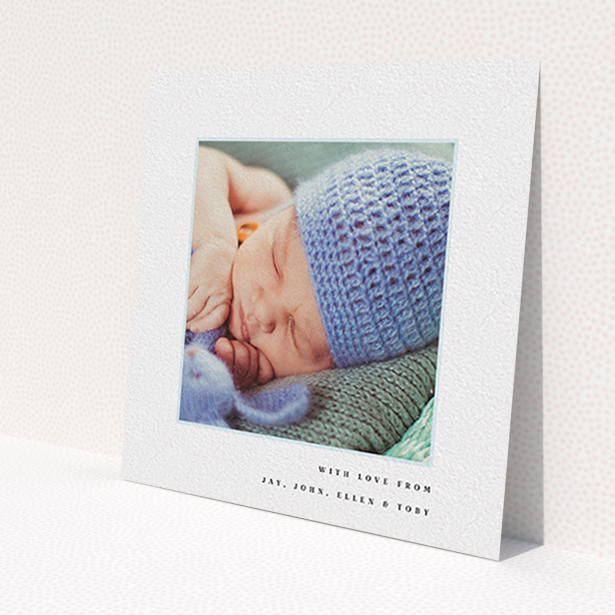 A baptism thank you card design named 'Thin Blue Frame'. It is a square (148mm x 148mm) card in a square orientation. It is a photographic baptism thank you card with room for 1 photo. 'Thin Blue Frame' is available as a flat card, with tones of white and blue.