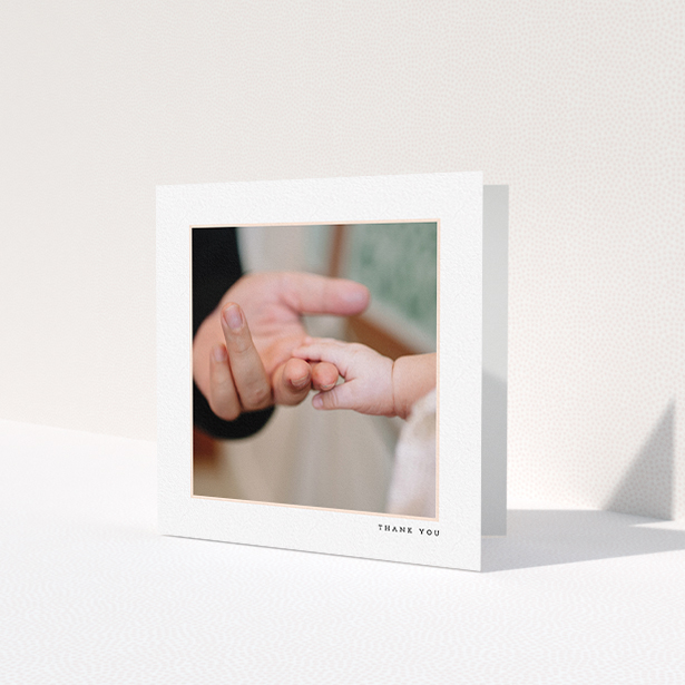 A baptism thank you card named 'Thin Pink Frame'. It is a square (148mm x 148mm) card in a square orientation. It is a photographic baptism thank you card with room for 1 photo. 'Thin Pink Frame' is available as a folded card, with tones of white and pink.