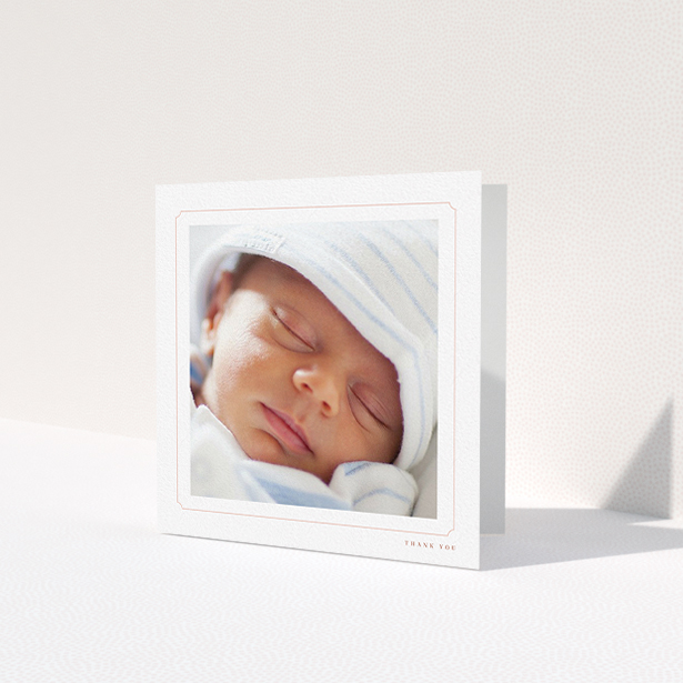 A baptism thank you card named 'Thin Pink'. It is a square (148mm x 148mm) card in a square orientation. It is a photographic baptism thank you card with room for 1 photo. 'Thin Pink' is available as a folded card, with tones of white and pink.