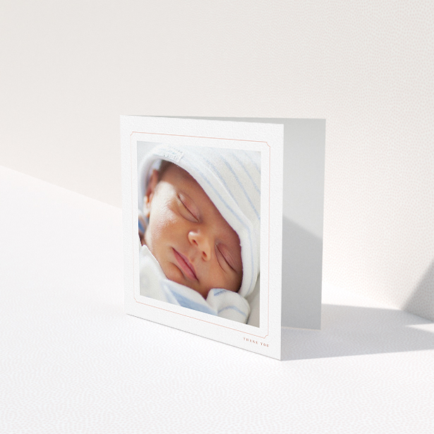 A baptism thank you card named "Thin Pink". It is a square (148mm x 148mm) card in a square orientation. It is a photographic baptism thank you card with room for 1 photo. "Thin Pink" is available as a folded card, with tones of white and pink.
