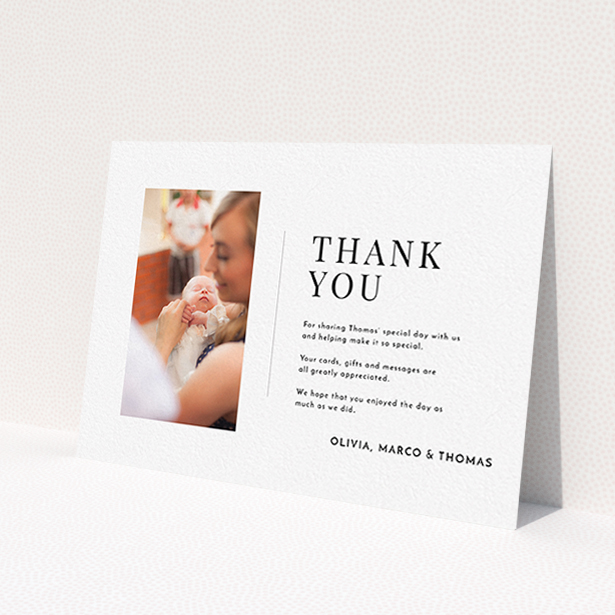 A baptism thank you card called 'Tiny Portrait'. It is an A6 card in a landscape orientation. It is a photographic baptism thank you card with room for 1 photo. 'Tiny Portrait' is available as a flat card, with mainly white colouring.