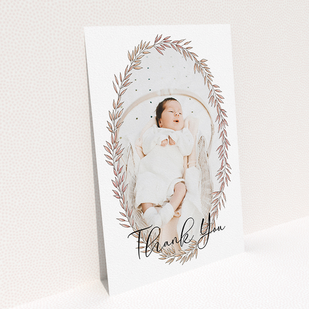 A baptism thank you card design titled "Tussled Wreath". It is an A5 card in a portrait orientation. It is a photographic baptism thank you card with room for 1 photo. "Tussled Wreath" is available as a flat card, with tones of pink and white.