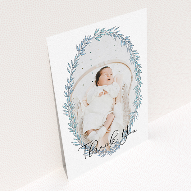 A baptism thank you card design called "Tussled Wreath". It is an A5 card in a portrait orientation. It is a photographic baptism thank you card with room for 1 photo. "Tussled Wreath" is available as a flat card, with tones of blue and white.