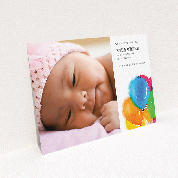 A birth announcement card named "Big Balloons". It is an A5 card in a landscape orientation. It is a photographic birth announcement card with room for 1 photo. "Big Balloons" is available as a flat card, with tones of white, orange and blue.