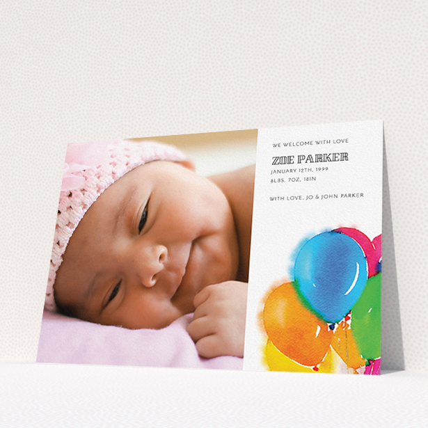 A birth announcement card named "Big Balloons". It is an A5 card in a landscape orientation. It is a photographic birth announcement card with room for 1 photo. "Big Balloons" is available as a flat card, with tones of white, orange and blue.