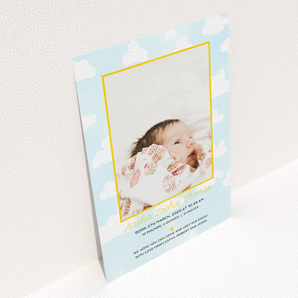 A birth announcement card design titled "Blue Skies". It is an A6 card in a portrait orientation. It is a photographic birth announcement card with room for 1 photo. "Blue Skies" is available as a flat card, with tones of blue, yellow and white.
