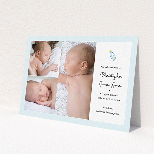 A birth announcement card called 'Bottled Up'. It is an A5 card in a landscape orientation. It is a photographic birth announcement card with room for 3 photos. 'Bottled Up' is available as a flat card, with tones of blue and white.