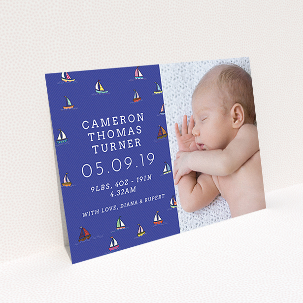 A birth announcement card template titled "Cowes Week". It is an A6 card in a landscape orientation. It is a photographic birth announcement card with room for 1 photo. "Cowes Week" is available as a flat card, with mainly blue colouring.