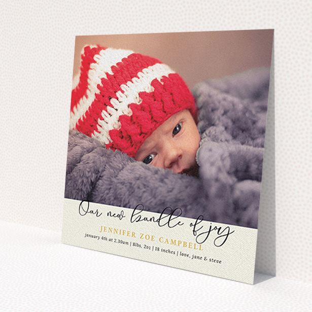 A birth announcement card design titled 'Our New Bundle of Joy'. It is a square (148mm x 148mm) card in a square orientation. It is a photographic birth announcement card with room for 1 photo. 'Our New Bundle of Joy' is available as a flat card, with tones of cream and gold.