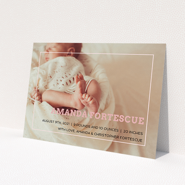 A birth announcement card design named 'Over Photo Frame'. It is an A5 card in a landscape orientation. It is a photographic birth announcement card with room for 1 photo. 'Over Photo Frame' is available as a flat card, with mainly light pink colouring.