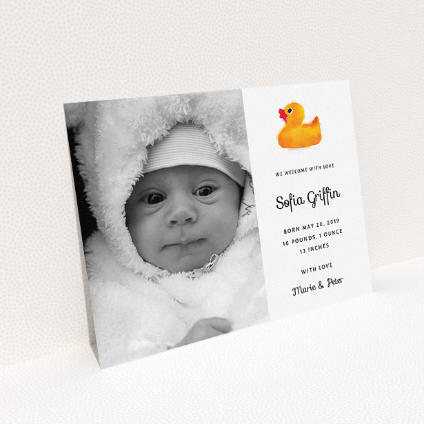 A birth announcement card named "Rubber Ducky". It is an A5 card in a landscape orientation. It is a photographic birth announcement card with room for 1 photo. "Rubber Ducky" is available as a flat card, with tones of orange and white.
