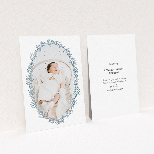 A birth announcement card called "Tussled Wreath". It is an A5 card in a portrait orientation. It is a photographic birth announcement card with room for 1 photo. "Tussled Wreath" is available as a flat card, with tones of blue and white.