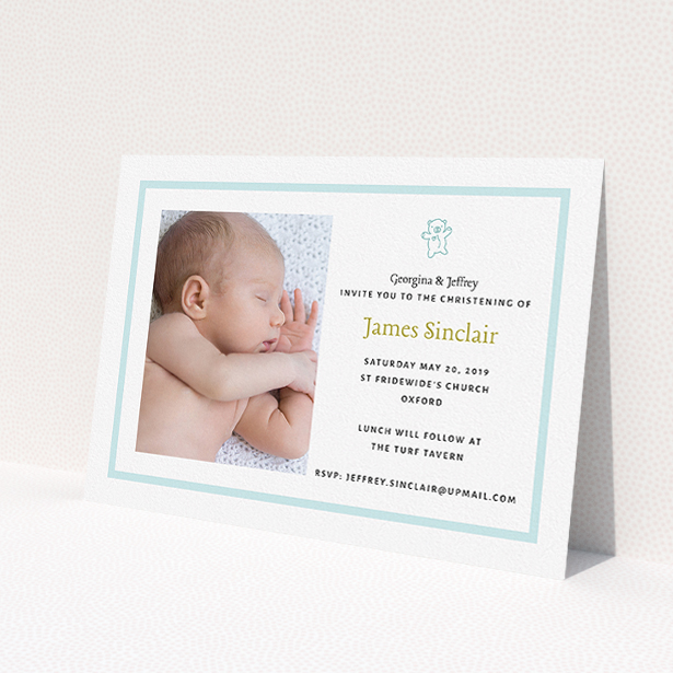 A christening invitation design named 'Blue Teddy'. It is an A5 invite in a landscape orientation. It is a photographic christening invitation with room for 1 photo. 'Blue Teddy' is available as a flat invite, with tones of blue and white.