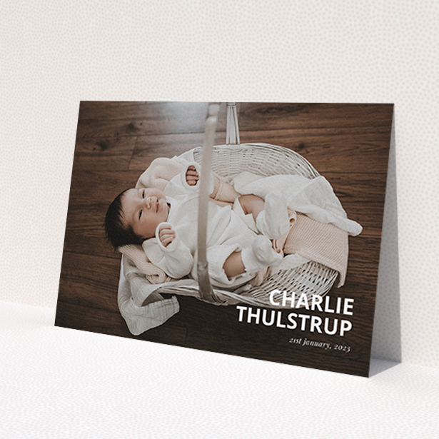 A christening invitation called 'Bold Corner Photo'. It is an A6 invite in a landscape orientation. It is a photographic christening invitation with room for 1 photo. 'Bold Corner Photo' is available as a flat invite, with mainly white colouring.