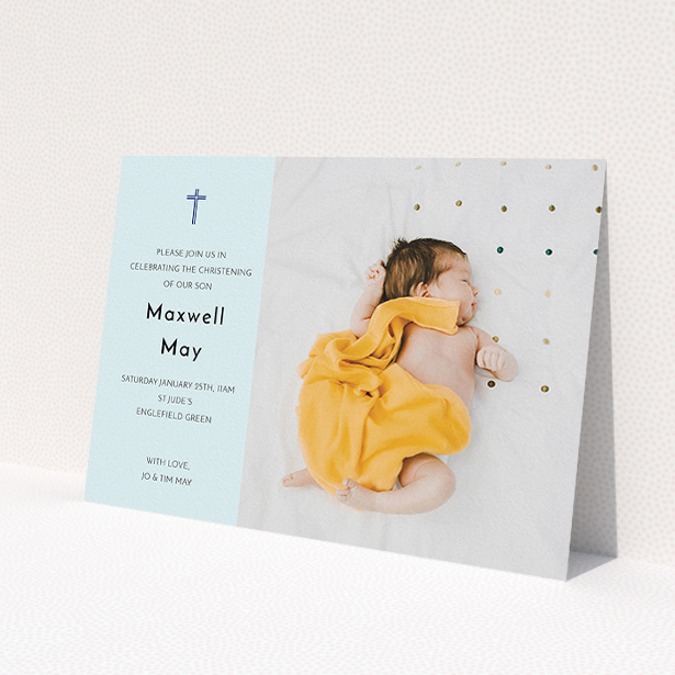 A christening invitation design called 'Cross Photo'. It is an A5 invite in a landscape orientation. It is a photographic christening invitation with room for 1 photo. 'Cross Photo' is available as a flat invite, with mainly blue colouring.