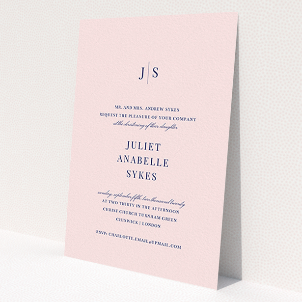 A christening invitation design called 'Monogrammed Pink Tradition'. It is an A6 invite in a portrait orientation. 'Monogrammed Pink Tradition' is available as a flat invite, with tones of blue and pink.