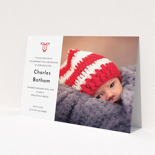 A christening invitation template titled 'Onesie'. It is an A5 invite in a landscape orientation. It is a photographic christening invitation with room for 1 photo. 'Onesie' is available as a flat invite, with tones of white and red.