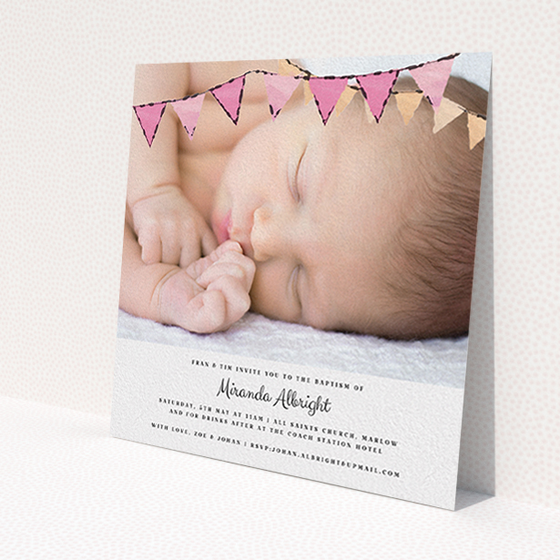 A christening invitation named 'Pink Bunting'. It is a square (148mm x 148mm) invite in a square orientation. It is a photographic christening invitation with room for 1 photo. 'Pink Bunting' is available as a flat invite, with tones of pink and white.