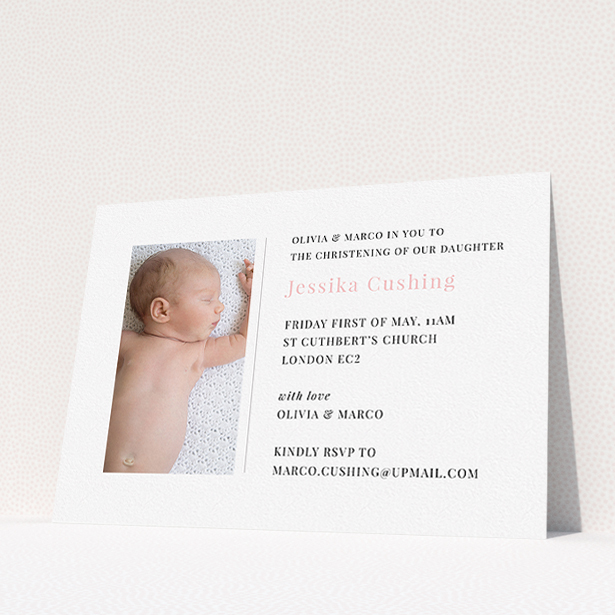 A christening invitation template titled "Please Welcome". It is an A5 invite in a landscape orientation. It is a photographic christening invitation with room for 1 photo. "Please Welcome" is available as a flat invite, with tones of white and pink.