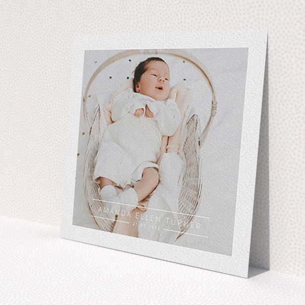 A christening invitation design titled 'Tramlines'. It is a square (148mm x 148mm) invite in a square orientation. It is a photographic christening invitation with room for 1 photo. 'Tramlines' is available as a flat invite, with mainly white colouring.