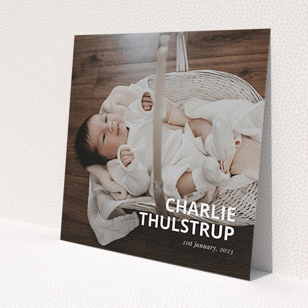 A christening invite design named 'Bold Corner Photo'. It is a square (148mm x 148mm) invite in a square orientation. It is a photographic christening invite with room for 1 photo. 'Bold Corner Photo' is available as a flat invite, with mainly white colouring.