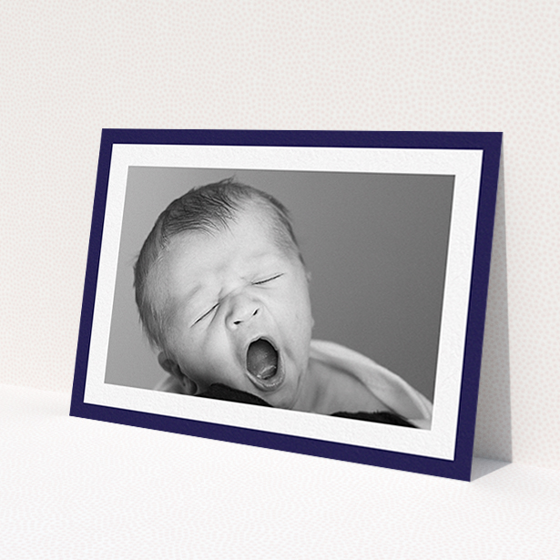 A christening invite template titled 'Classic Navy Photo Frame'. It is an A6 invite in a landscape orientation. It is a photographic christening invite with room for 1 photo. 'Classic Navy Photo Frame' is available as a flat invite, with tones of blue and white.