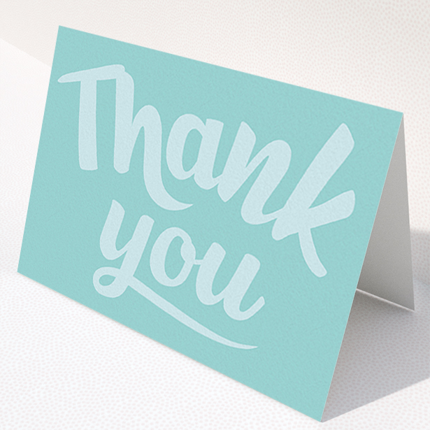 A christening thank you card called "Big Blue Typography". It is an A6 card in a landscape orientation. "Big Blue Typography" is available as a folded card, with mainly blue colouring.