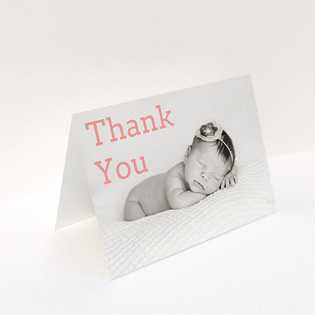 A christening thank you card design titled "Big Thanks". It is an A6 card in a landscape orientation. It is a photographic christening thank you card with room for 1 photo. "Big Thanks" is available as a folded card, with mainly light pink colouring.