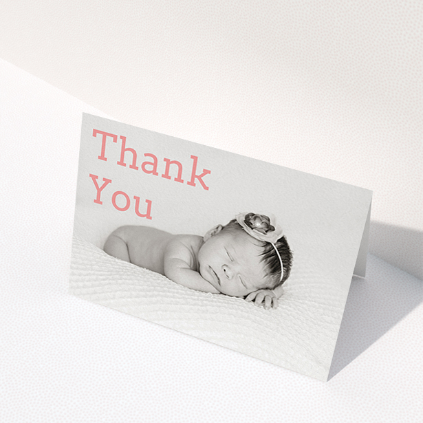 A christening thank you card design titled "Big Thanks". It is an A6 card in a landscape orientation. It is a photographic christening thank you card with room for 1 photo. "Big Thanks" is available as a folded card, with mainly light pink colouring.