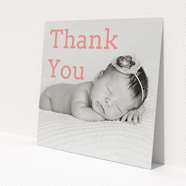 A christening thank you card named 'Big Thanks'. It is a square (148mm x 148mm) card in a square orientation. It is a photographic christening thank you card with room for 1 photo. 'Big Thanks' is available as a flat card, with mainly light pink colouring.