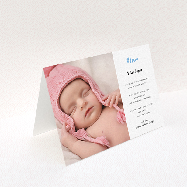A christening thank you card design named "Blue Fern". It is an A6 card in a landscape orientation. It is a photographic christening thank you card with room for 1 photo. "Blue Fern" is available as a folded card, with tones of white and blue.