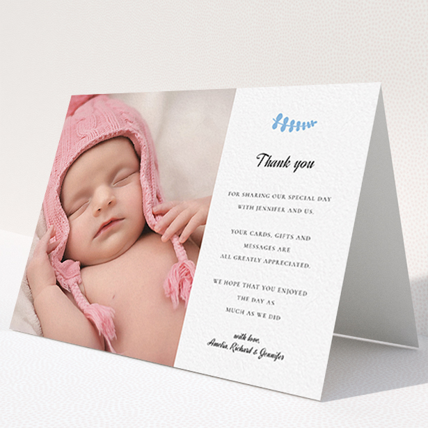 A christening thank you card design named "Blue Fern". It is an A6 card in a landscape orientation. It is a photographic christening thank you card with room for 1 photo. "Blue Fern" is available as a folded card, with tones of white and blue.