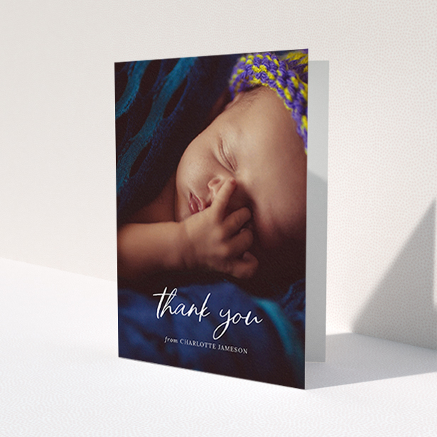 A christening thank you card template titled 'Calligraphy Thanks'. It is an A6 card in a portrait orientation. It is a photographic christening thank you card with room for 1 photo. 'Calligraphy Thanks' is available as a folded card, with mainly white colouring.