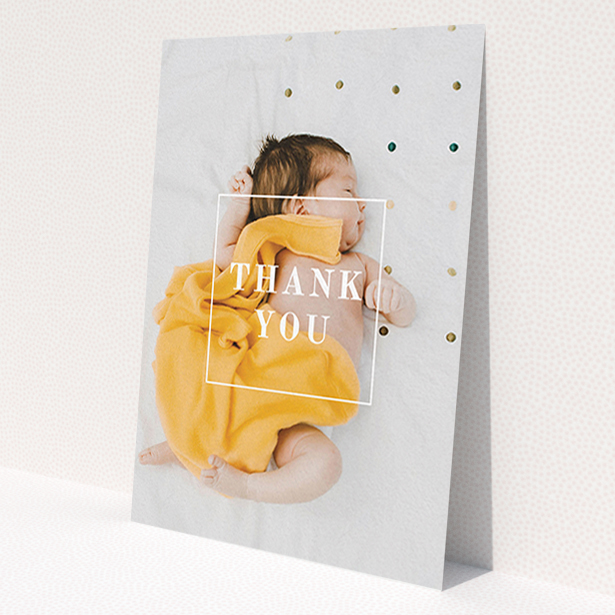 A christening thank you card design titled 'Central Thanks'. It is an A6 card in a portrait orientation. It is a photographic christening thank you card with room for 1 photo. 'Central Thanks' is available as a flat card, with mainly white colouring.