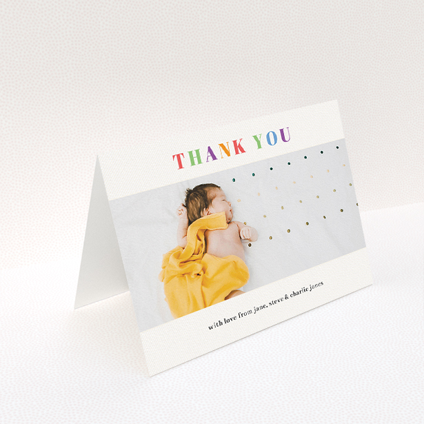 A christening thank you card named "Colourful Thanks". It is an A5 card in a landscape orientation. It is a photographic christening thank you card with room for 1 photo. "Colourful Thanks" is available as a folded card, with tones of white and orange.