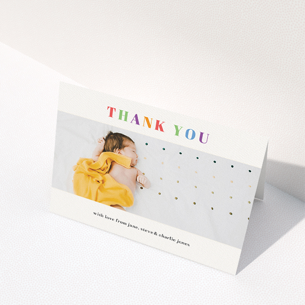 A christening thank you card named "Colourful Thanks". It is an A5 card in a landscape orientation. It is a photographic christening thank you card with room for 1 photo. "Colourful Thanks" is available as a folded card, with tones of white and orange.
