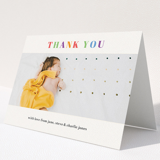 A christening thank you card named "Colourful Thanks". It is an A5 card in a landscape orientation. It is a photographic christening thank you card with room for 1 photo. "Colourful Thanks" is available as a folded card, with tones of white and orange.
