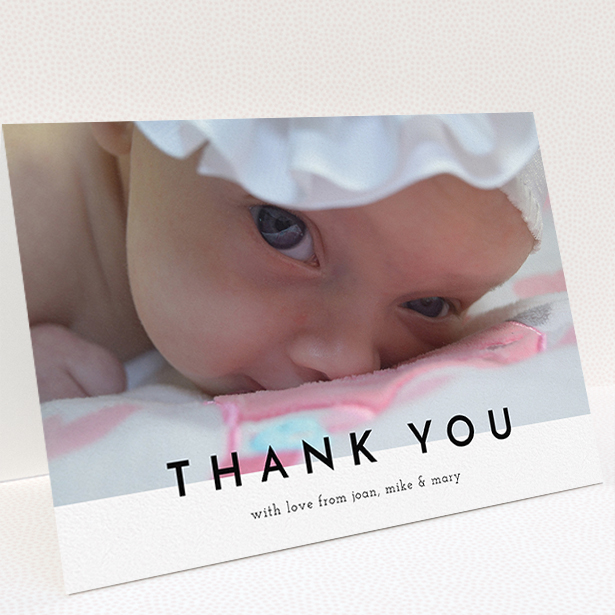 A christening thank you card named "Cross Border". It is an A5 card in a landscape orientation. It is a photographic christening thank you card with room for 1 photo. "Cross Border" is available as a folded card, with mainly white colouring.