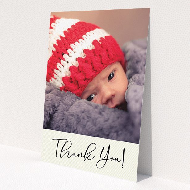 A christening thank you card design called 'Cursive Thanks'. It is an A5 card in a portrait orientation. It is a photographic christening thank you card with room for 1 photo. 'Cursive Thanks' is available as a flat card, with mainly cream colouring.