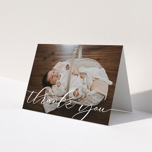 A christening thank you card design titled 'One Photo'. It is an A6 card in a landscape orientation. It is a photographic christening thank you card with room for 1 photo. 'One Photo' is available as a folded card, with mainly white colouring.