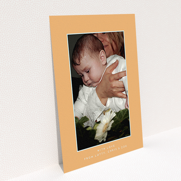 A christening thank you card design named "Orange and Mint". It is an A6 card in a portrait orientation. It is a photographic christening thank you card with room for 1 photo. "Orange and Mint" is available as a flat card, with tones of orange and blue.