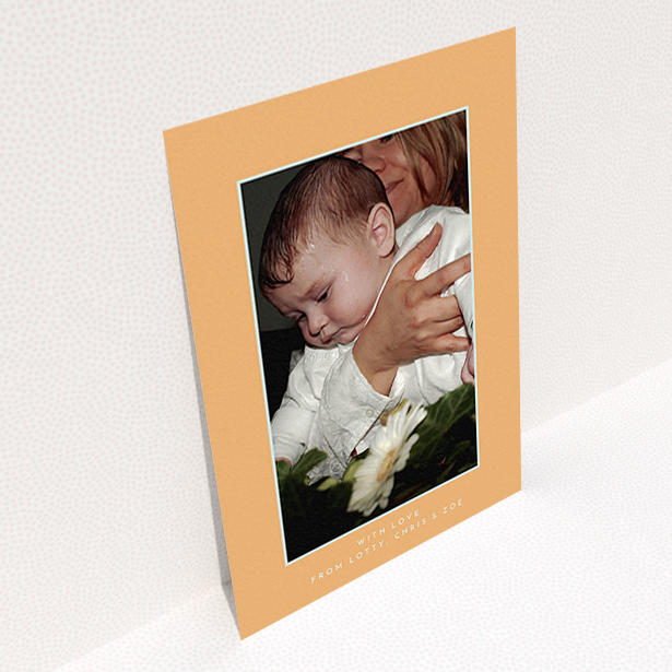 A christening thank you card design named "Orange and Mint". It is an A6 card in a portrait orientation. It is a photographic christening thank you card with room for 1 photo. "Orange and Mint" is available as a flat card, with tones of orange and blue.