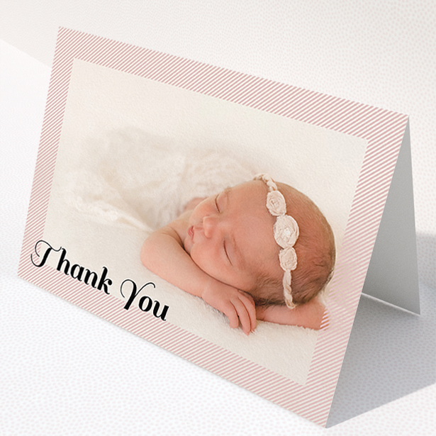 A christening thank you card named "Pastel Diagonals". It is an A5 card in a landscape orientation. It is a photographic christening thank you card with room for 1 photo. "Pastel Diagonals" is available as a folded card, with mainly pink colouring.
